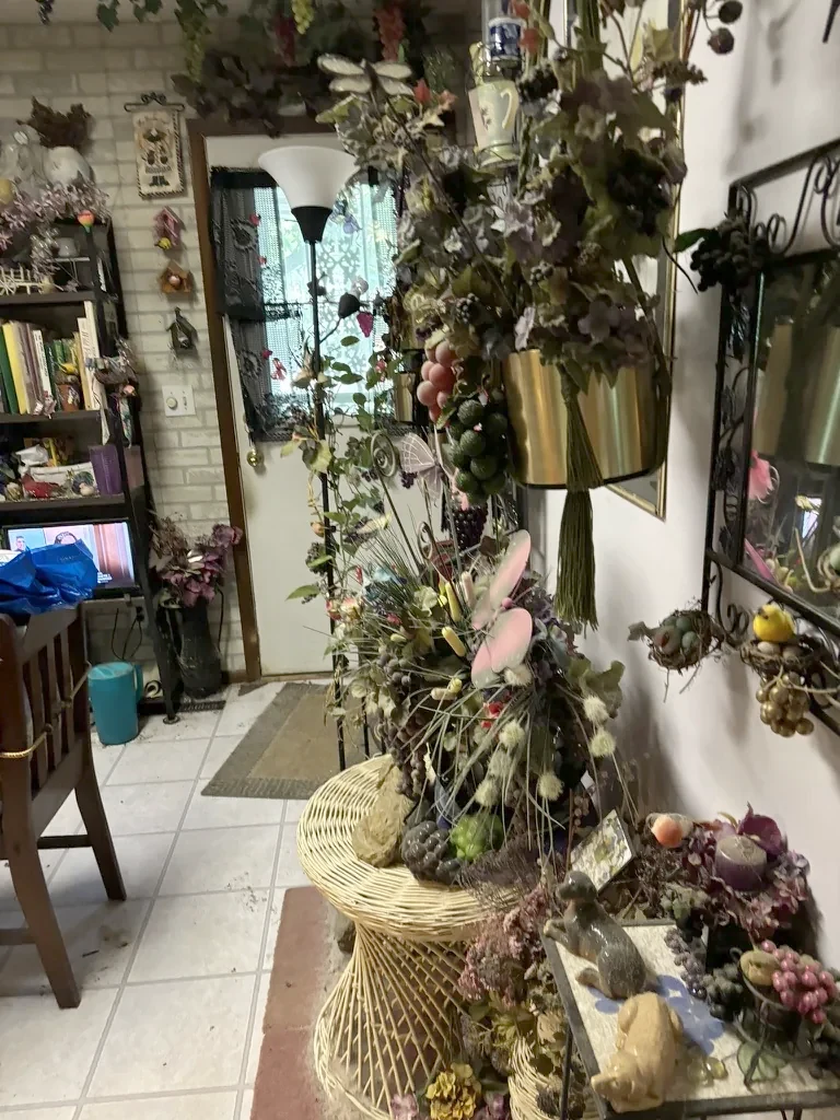 Entry hall as purchased, tile floor and hanging arrangements