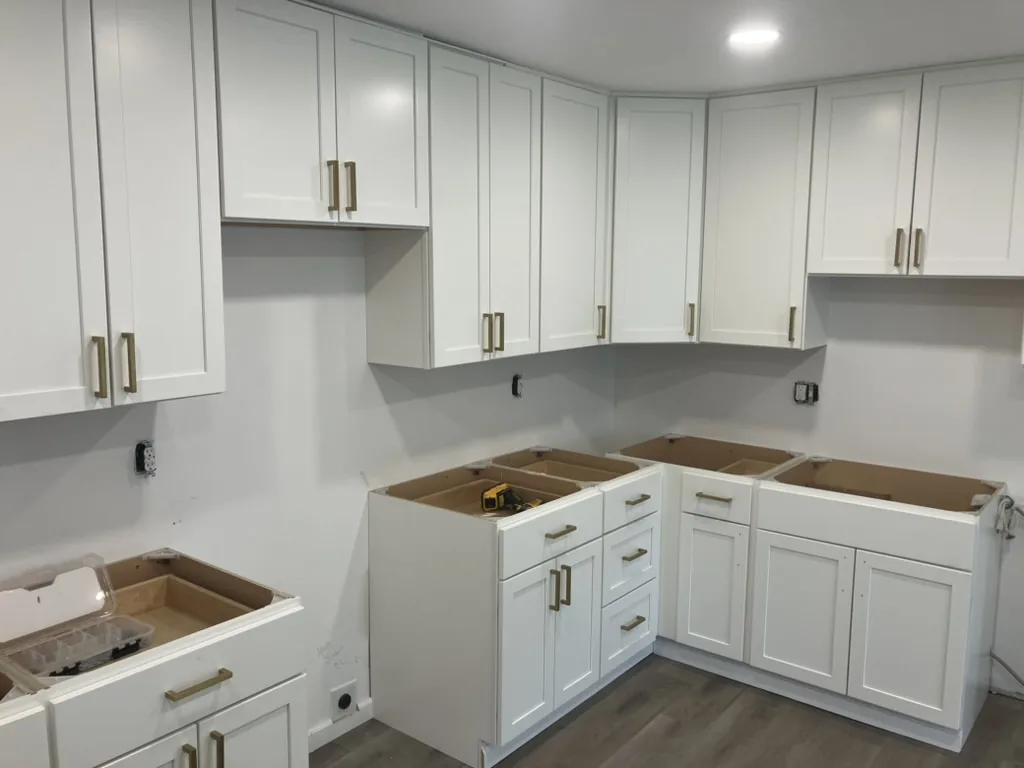 New white shaker cabinets set, counters not yet installed