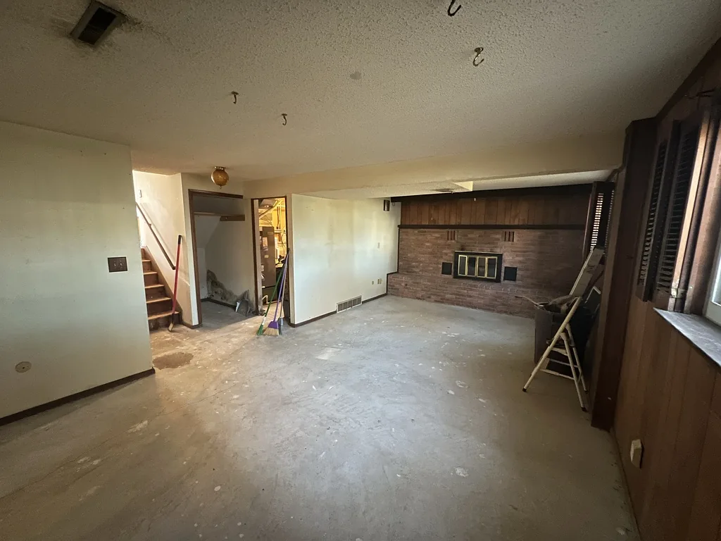 Lower level stripped to bare floor